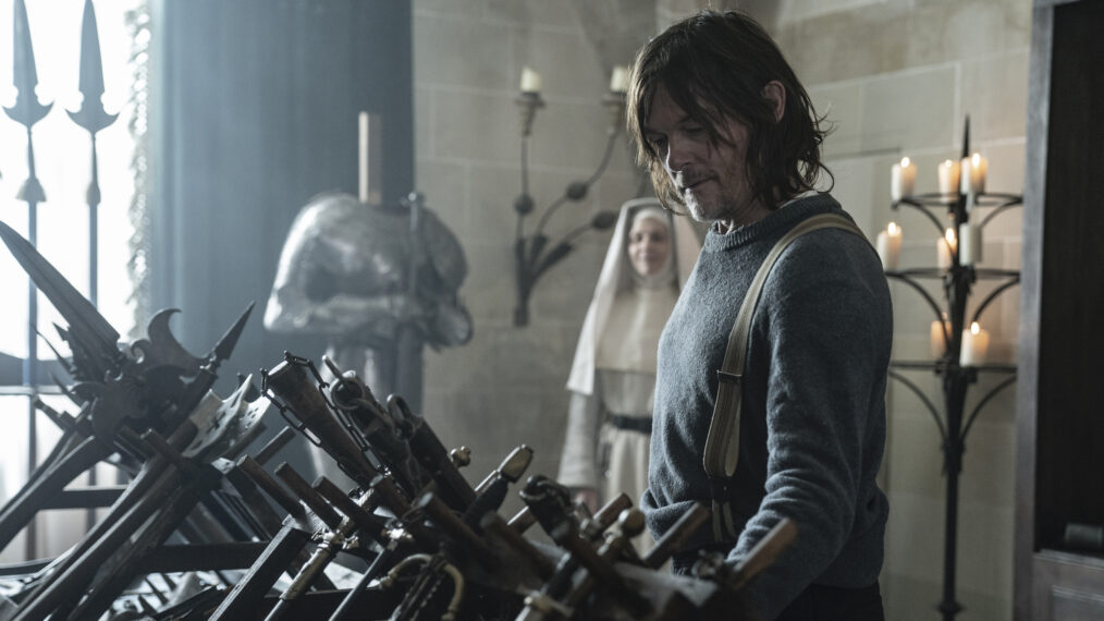 Norman Reedus peruses weapons as Daryl Dixon in 'The Walking Dead: Daryl Dixon' series premiere
