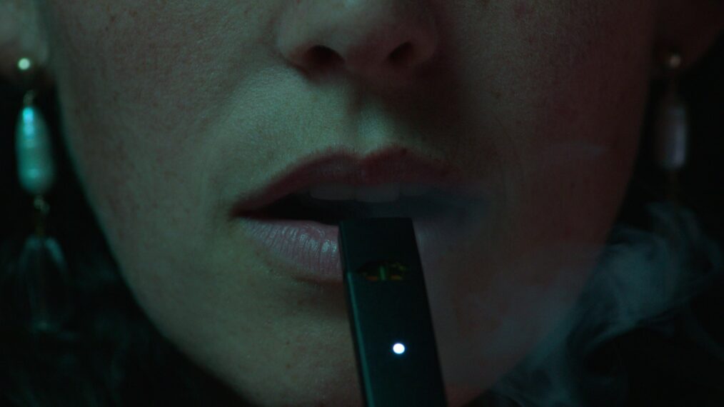 A woman smokes a vape in Netflix's 'Big Vape: The Rise and Fall of Juul' documentary