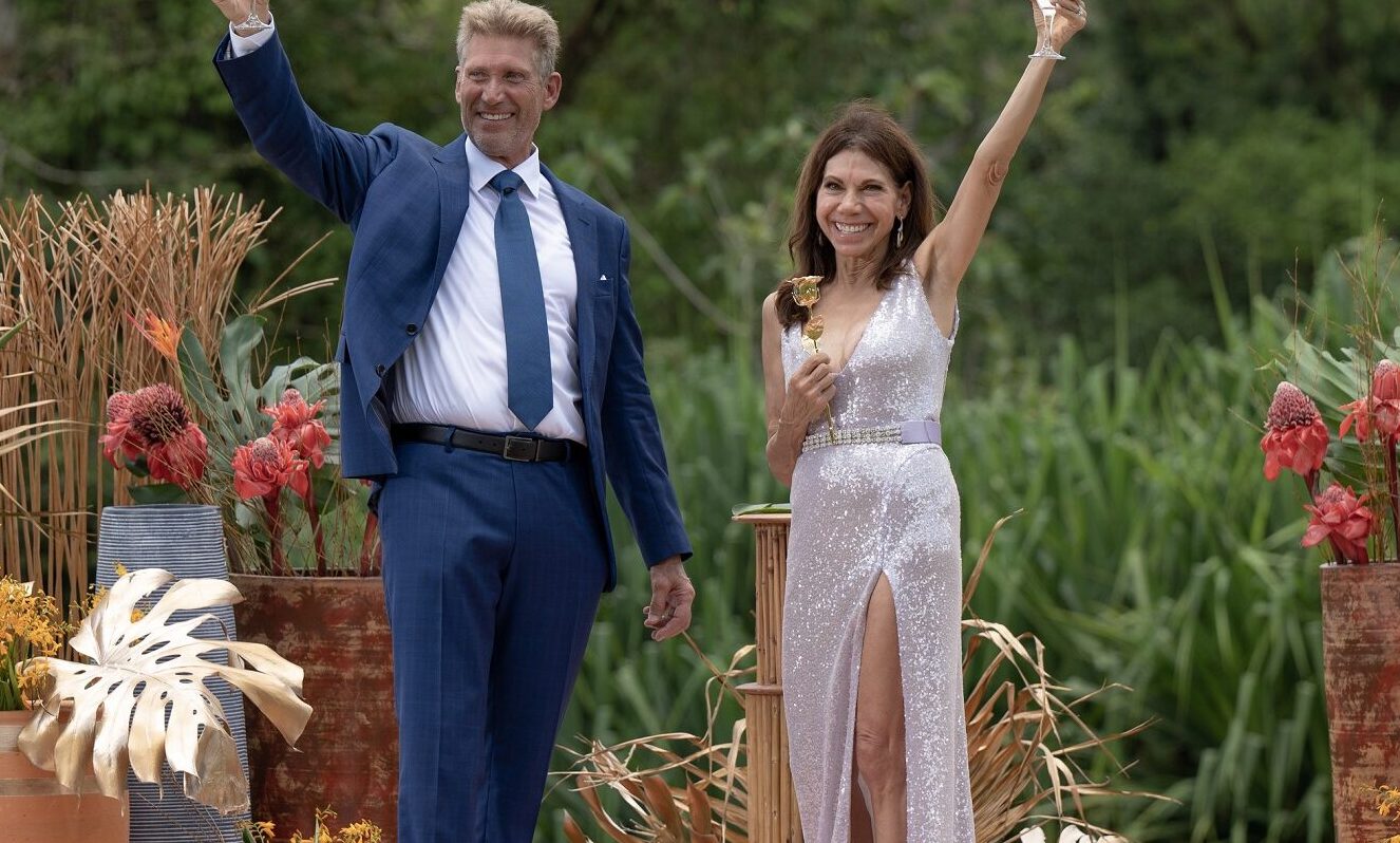 Gerry Turner and Theresa Nist raising champagne on The Golden Bachelor