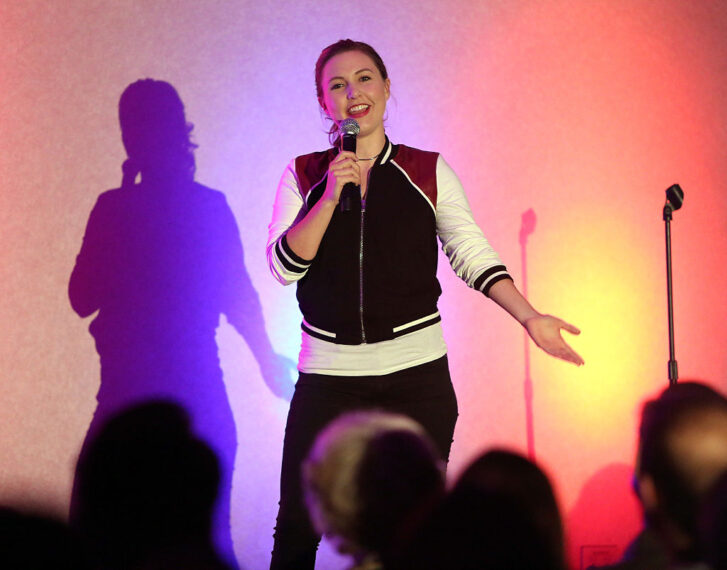 LOS ANGELES, CA - OCTOBER 23: Comdian Taylor Tomlinson performs onstage during the NextGen Climate and Funny or Die's "Jokes For Votes" Tour at USC on October 23, 2016 in Los Angeles, California