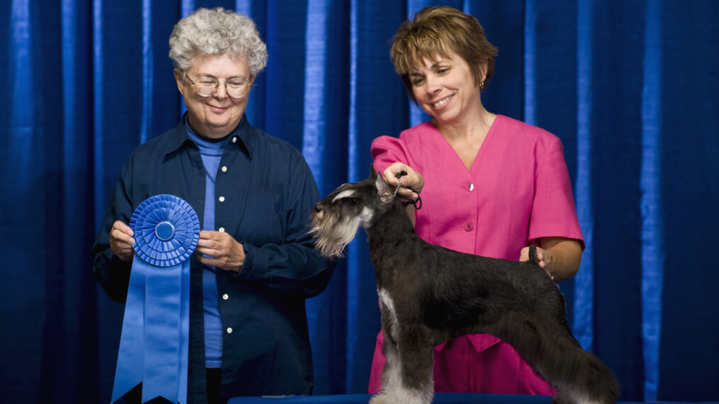Owner, judge and dog with first place ribbon