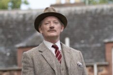 Douglas Henshall as Major Horton walking bulldogs in 'Murder Is Easy'