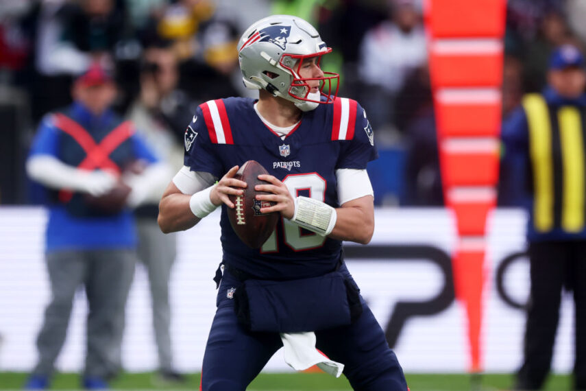 FRANKFURT AM MAIN, GERMANY - NOVEMBER 12: Mac Jones #10 of the New England Patriots looks to pass from the pocket in the first quarter during the NFL match between the Indianapolis Colts and the New England Patriots at Deutsche Bank Park on November 12, 2023 in Frankfurt am Main, Germany