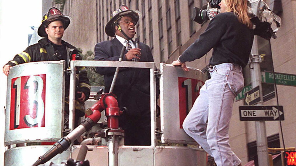 NBC weatherman Al Roker broadcasts live from the back of a firetruck 10 October outside NBC studios at Rockefeller Center in New York.