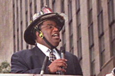 NBC weatherman Al Roker broadcasts live from the back of a firetruck 10 October outside NBC studios at Rockefeller Center in New York.