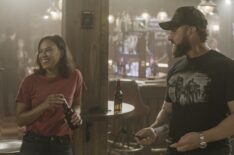 Toni Trucks as Lisa Davis and AJ Buckley as Sonny Quinn playing darts at the bar in 'SEAL Team' - 'The New Normal'