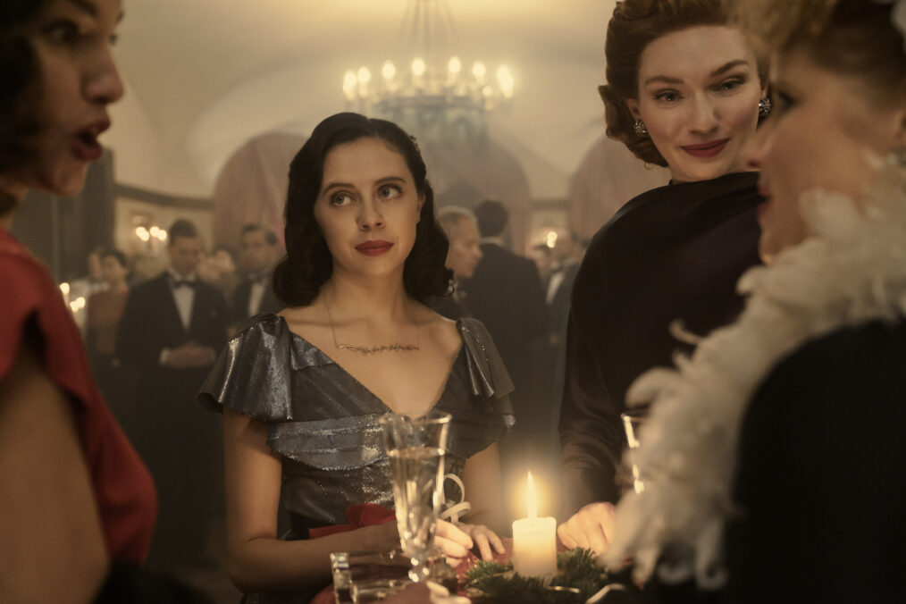 Miep, played by Bel Powley, and Tess, played by Eleanor Tomlinson, attend a party in A SMALL LIGHT. (Credit: National Geographic for Disney/Dusan Martincek)