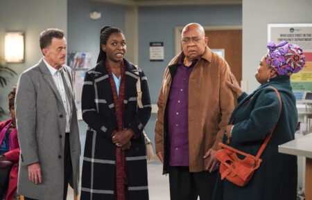 Billy Gardell as Bob, Folake Olowofoyeku as Abishola, Barry Shabaka Henley as Uncle Tunde, and Shola Adewusi as Auntie Olu in Bob Hearts Abishola - 'Kill the Cat'