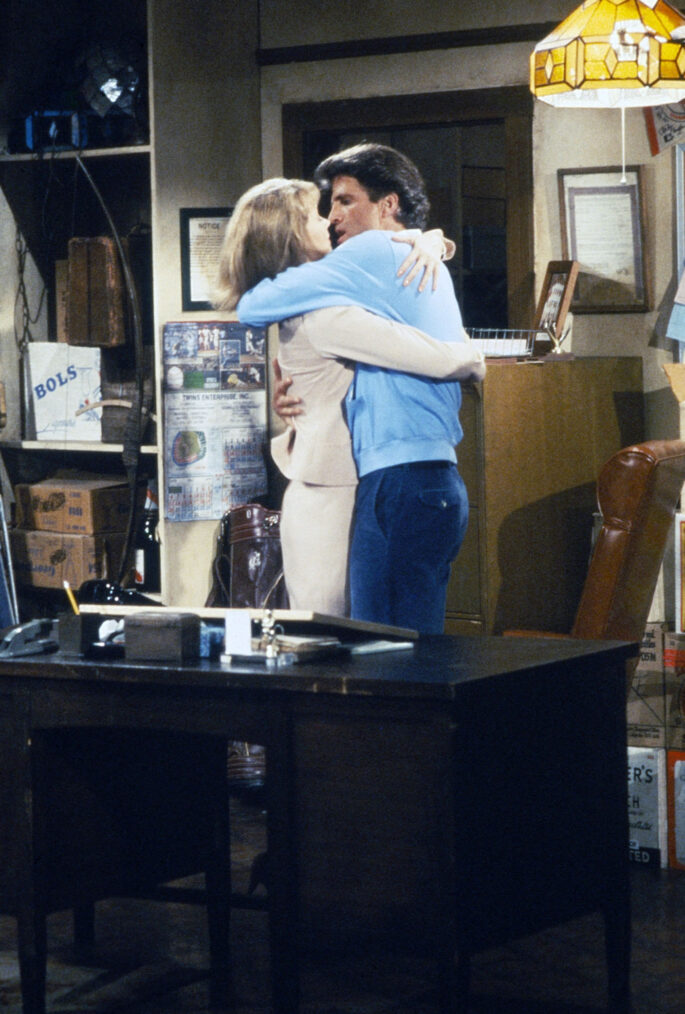 Shelley Long and Ted Danson kissing on Cheers