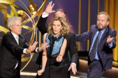 Greg Germann, Calista Flockhart, Gil Bellows and Peter MacNicol of Ally McBeal dance onstage during the 75th Primetime Emmy Awards