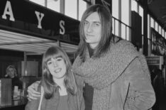 English model Jenny Boyd and British musician and actor Mick Fleetwood of rock band Fleetwood Mac at Heathrow Airport in February 1970