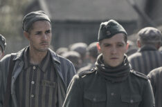 Jonah Hauer-King as Lali Sokolov with Jonas Nay as Nazi officer Stefan Baretzki in The Tattooist of Auschwitz