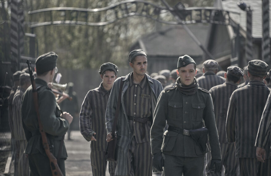 Jonah Hauer-King as Lali Sokolov with Jonas Nay as Nazi officer Stefan Baretzki