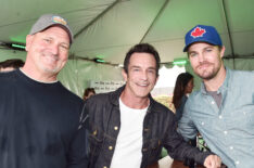 Producer John Kirhoffer, TV personality Jeff Probst and actor Stephen Amell pose backstage during Entertainment Weekly's PopFest in October 2016