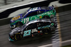 Bubba Wallace, driver of the #23 Columbia Sportswear Company Toyota, and Martin Truex Jr., driver of the #19 Bass Pros Shops/Ducks Unlimited Toyota, race during the NASCAR Cup Series Coke Zero Sugar 400 at Daytona International Speedway on August 26, 2023 in Daytona Beach, Florida.