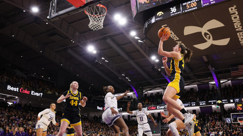 Caitlin Clark #22 of the Iowa Hawkeyes scores her 3,403 career point, passing Kelsey Mitchell for second in Division I NCAA women's basketball history, during the second quarter against the Northwestern Wildcats at Welsh-Ryan Arena on January 31, 2024 in Evanston, Illinois.