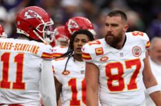 Tight end Travis Kelce #87 of the Kansas City Chiefs talks with wide receiver Marquez Valdes-Scantling #11 during warmups before playing the Baltimore Ravens in the AFC Championship Game