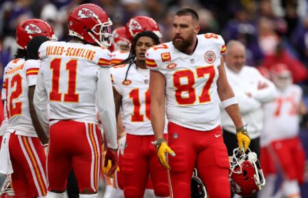 Tight end Travis Kelce #87 of the Kansas City Chiefs talks with wide receiver Marquez Valdes-Scantling #11 during warmups before playing the Baltimore Ravens in the AFC Championship Game