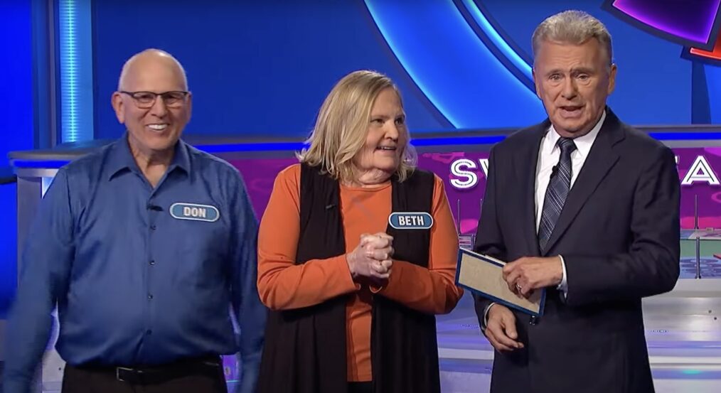 Pat Sajak with couple on Wheel of Fortune