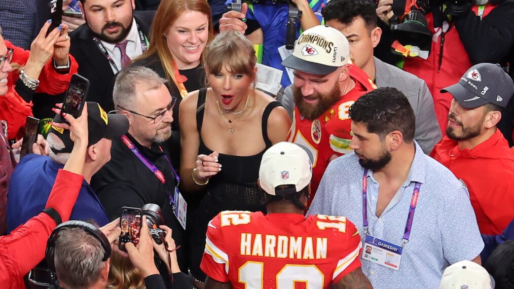 Mecole Hardman Jr. #12 of the Kansas City Chiefs celebrates with Travis Kelce #87 and Taylor Swift after defeating the San Francisco 49ers 25-22 during Super Bowl LVIII at Allegiant Stadium
