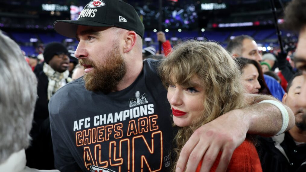 Travis Kelce and Taylor Swift on the field after the 2024 AFC Championship game