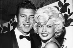 Jayne Mansfield surprised even Hollywood's jaded eyes when she arrived at a recent filmtown soiree with her husband Mickey Hargitay dressed in a black silk dress with a plunging neckline that didn't stop plunging.