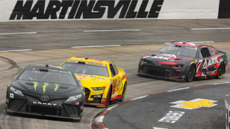 Ty Gibbs, driver of the #23 Monster Energy Toyota, Joey Logano, driver of the #22 Shell Pennzoil Ford, and Corey LaJoie, driver of the #7 ARK.io Chevrolet, drive during practice for the NASCAR Cup Series Xfinity 500 at Martinsville Speedway on October 29, 2022 in Martinsville, Virginia