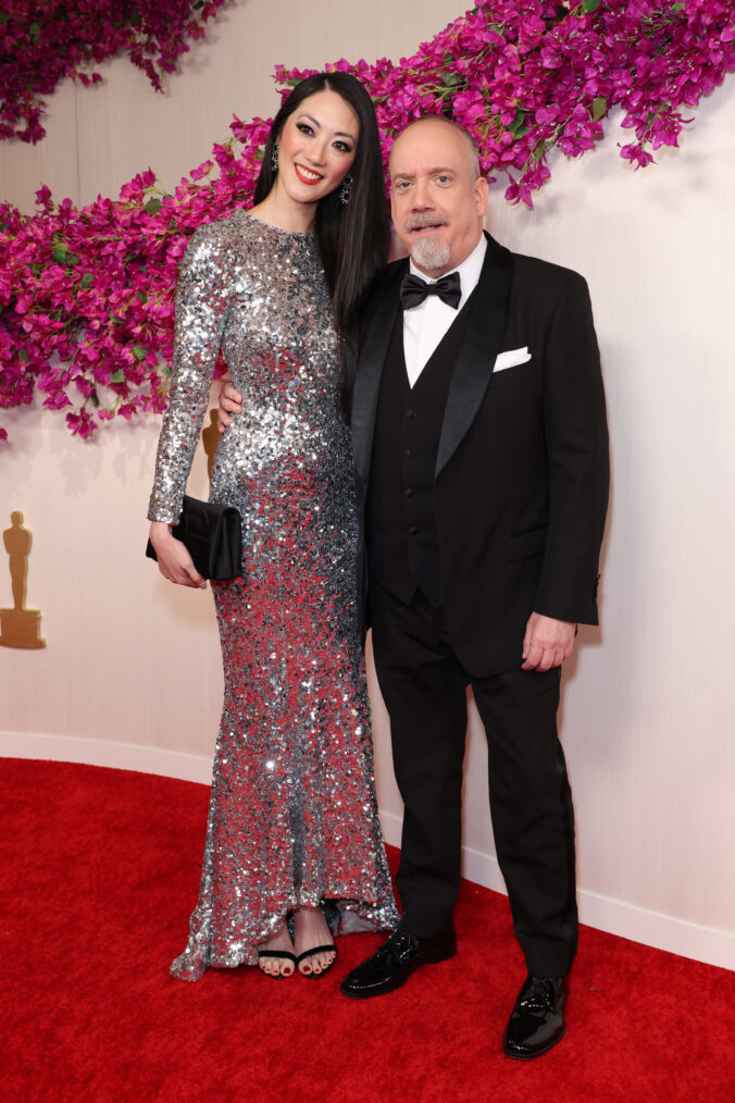 Clara Wong and Paul Giamatti attends the 96th Annual Academy Awards