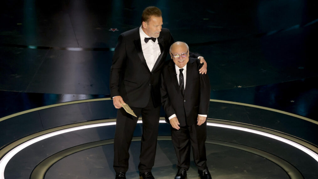 Arnold Schwarzenegger and Danny DeVito speak onstage during the 96th Annual Academy Awards at Dolby Theatre on March 10, 2024 in Hollywood, California.