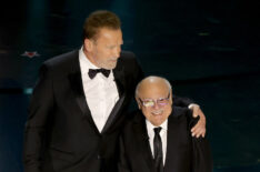 Arnold Schwarzenegger and Danny DeVito speak onstage during the 96th Annual Academy Awards at Dolby Theatre on March 10, 2024 in Hollywood, California.