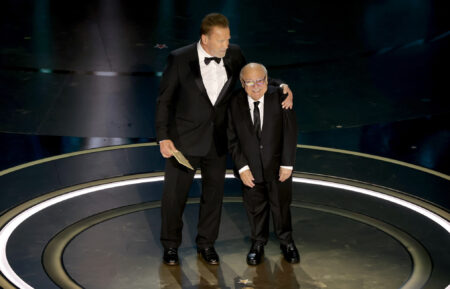 Arnold Schwarzenegger and Danny DeVito speak onstage during the 96th Annual Academy Awards at Dolby Theatre on March 10, 2024 in Hollywood, California.