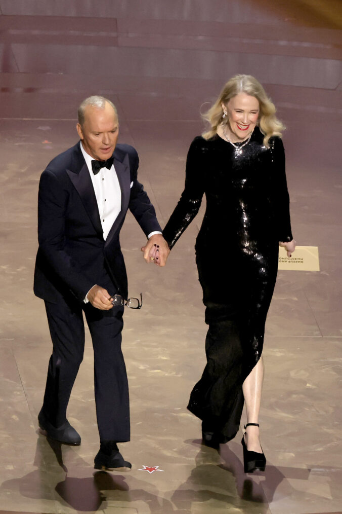 Michael Keaton and Catherine O'Hara speak onstage during the 96th Annual Academy Awards