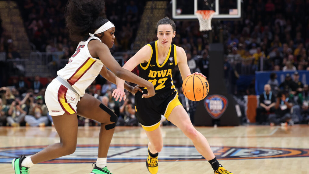 Caitlin Clark #22 of the Iowa Hawkeyes dribbles around Raven Johnson #25 of the South Carolina Gamecocks in the first half during the 2024 NCAA Women's Basketball Tournament National Championship at Rocket Mortgage FieldHouse on April 07, 2024 in Cleveland, Ohio.