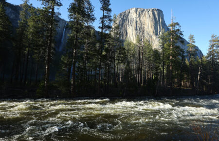 The snowmelt swollen Merced River flows past El Capitan in Yosemite Valley on April 28, 2023