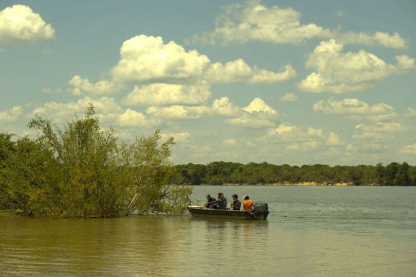 Team on boat in Madeira river, Porto Velho, Brazil