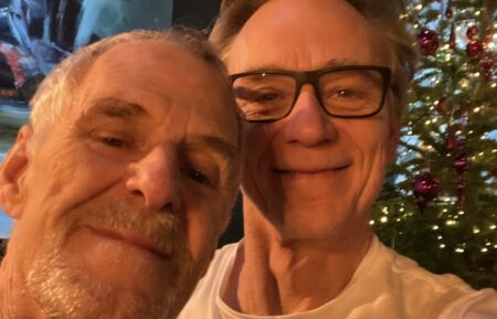 Married actors Ian Gelder and Ben Daniels pose for a selfie in front of their Christmas tree