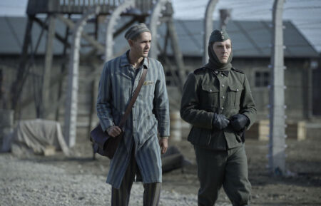 Jonah Hauer-King as Lali Sokolov & Jonas Nay as Nazi Officer Stefan Baretzki in 'The Tattooist of Auschwitz'