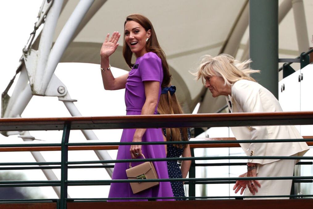 LONDON, ENGLAND - JULY 14: Catherine, Princess of Wales, Patron of The AELTC waves from the player's walkway bridge with Princess Charlotte and Deborah Jevans, Chairwoman of the AELTC during day fourteen of The Championships Wimbledon 2024 at All England Lawn Tennis and Croquet Club on July 14, 2024 in London, England. (Photo by Sean M. Haffey/Getty Images)