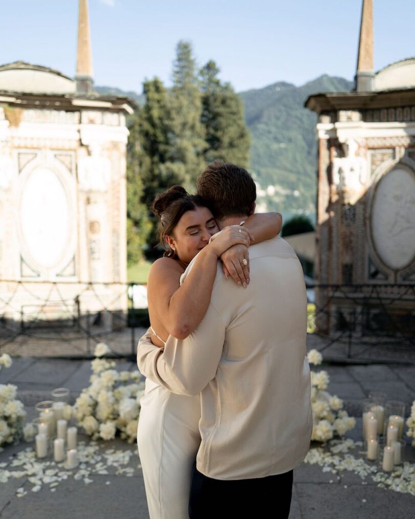 Kalani Hilliker and Nathan Goldman hug each other.