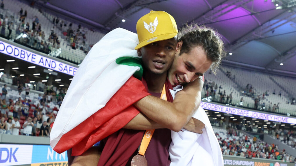 Bronze medalist Mutaz Essa Barshim of Team Qatar celebrates with gold medalist Gianmarco Tamberi of Team Italy after the Men's High Jump Final during day four of the World Athletics Championships Budapest 2023 at National Athletics Centre on August 22, 2023 in Budapest, Hungary.