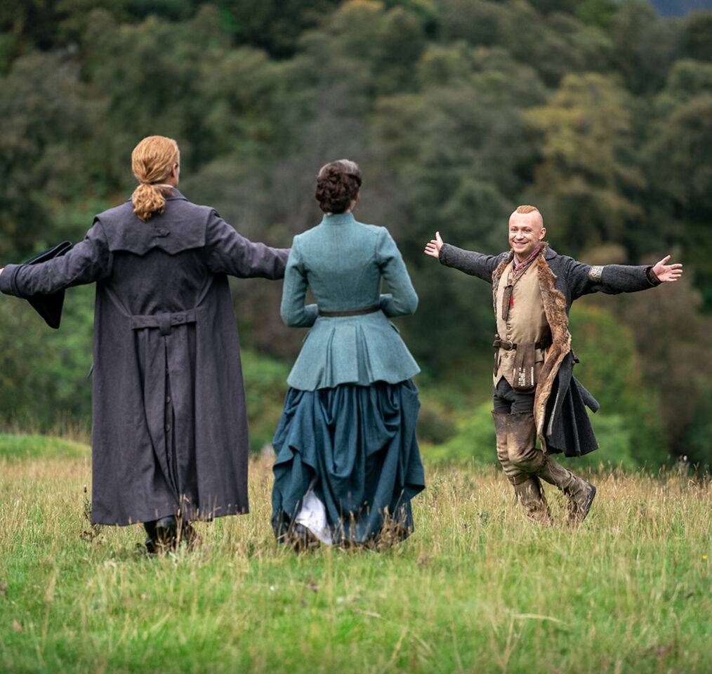 Caitríona Balfe as Claire, Sam Heughan as Jamie, John Bell as Young Ian on set of 'Outlander' Season 7 Part 2