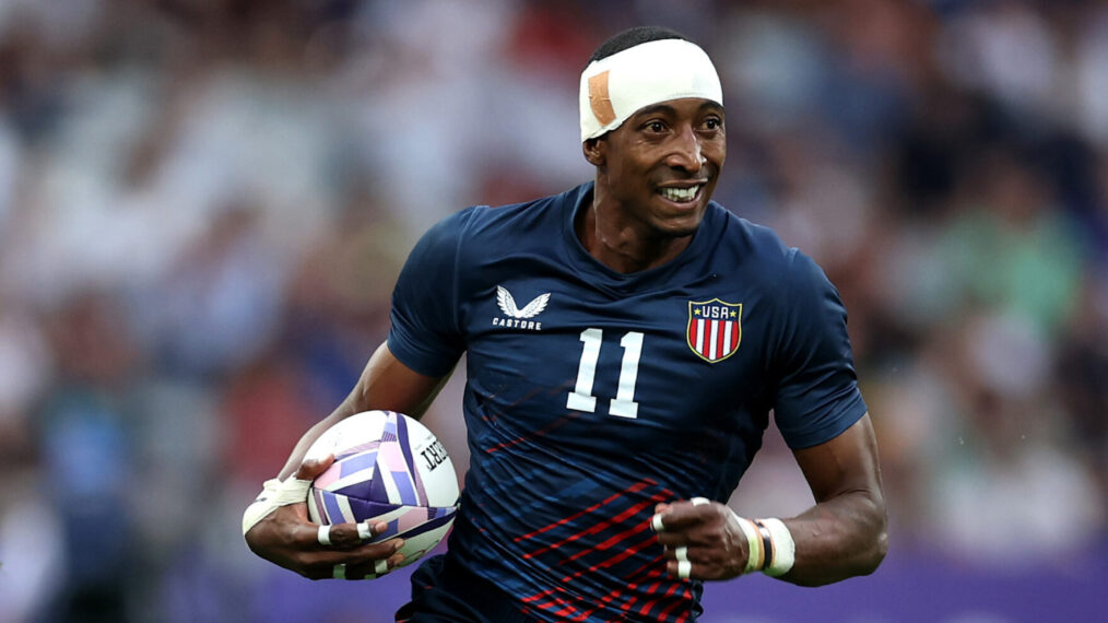 Perry Baker #11 of Team United States makes a break with the ball during the Men's Rugby Sevens Pool C Group match between Fiji and United States on Day -2 of the Olympic Games Paris 2024 at Stade de France on July 24, 2024 in Paris, France.