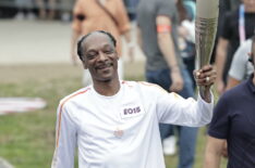 Snoop Dogg holds the torch as part of the 2024 Paris Olympic Games Torch Relay, in Saint-Denis on July 26, 2024 in Paris, France.