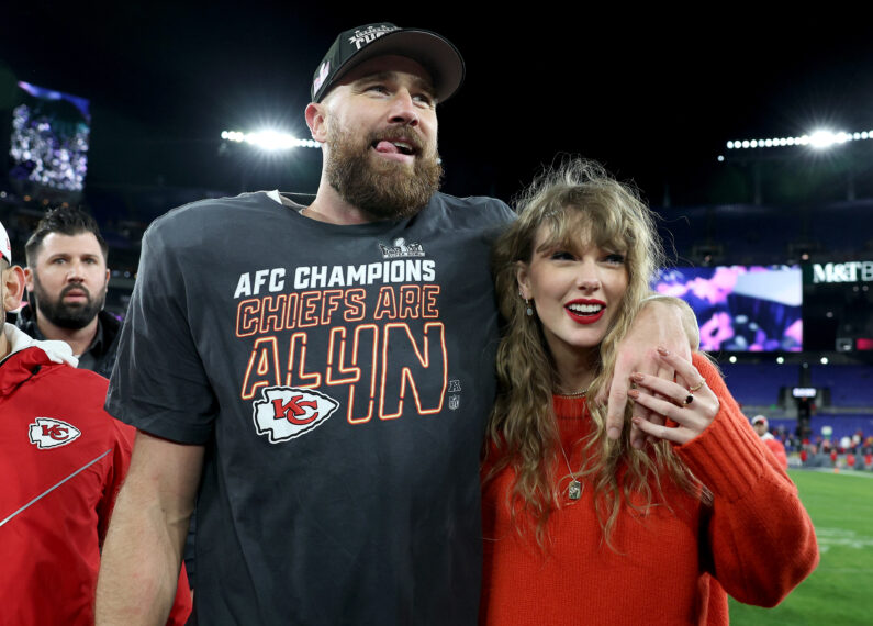 Travis Kelce #87 of the Kansas City Chiefs celebrates with Taylor Swift after a 17-10 victory against the Baltimore Ravens in the AFC Championship Game