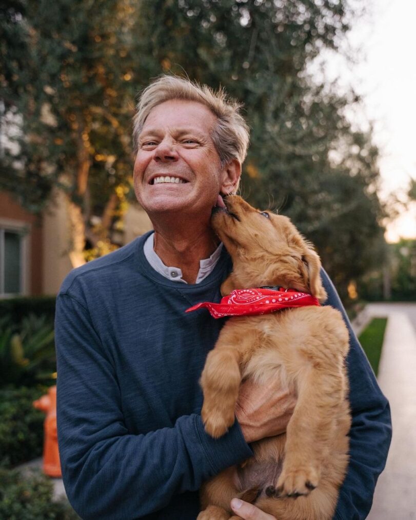 Dan Roemer of ' The Golden Bachelorette' with a dog
