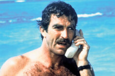 Tom Selleck as Thomas Magnum, making a mobile phone call from the beach, in the American TV series 'Magnum PI', circa 1985.