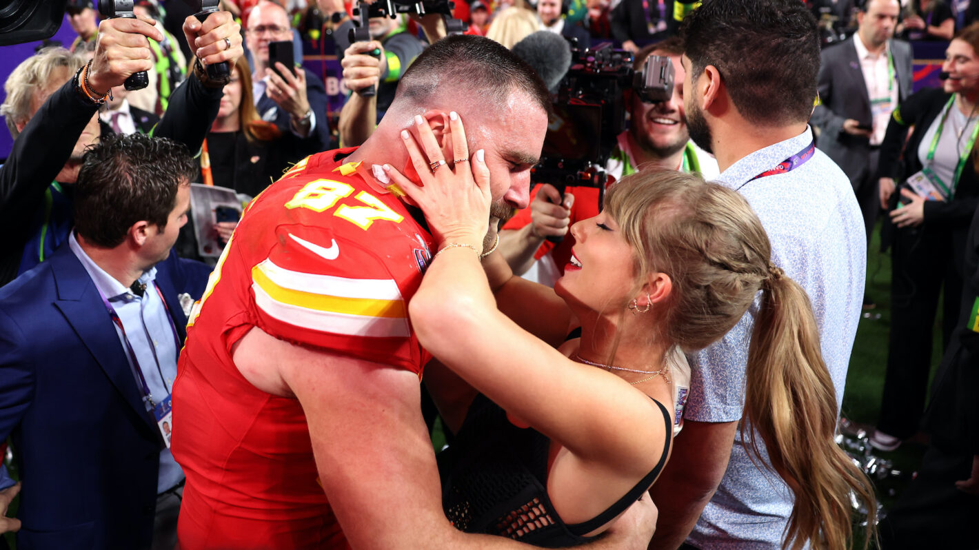 Travis Kelce #87 of the Kansas City Chiefs celebrates with Taylor Swift after defeating the San Francisco 49ers 25-22 in overtime during Super Bowl LVIII at Allegiant Stadium on February 11, 2024 in Las Vegas, Nevada.