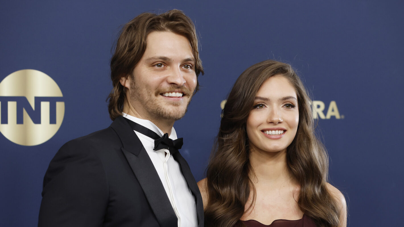Luke Grimes and Bianca Rodrigues attend the 28th Annual Screen Actors Guild Awards at Barker Hangar on February 27, 2022 in Santa Monica, California.
