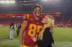 Walker Lyons and Rylee Arnold on the field at USC Trojans game.