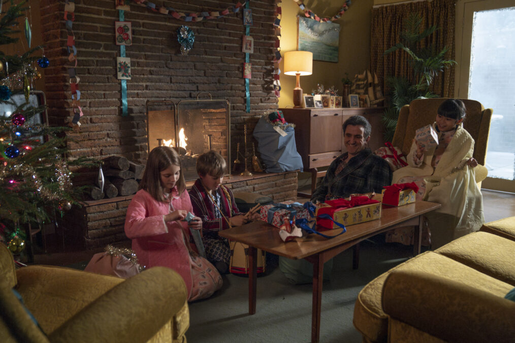 Aice Brown as Angela Turner, Edward Shaw as Teddy Turner, Stephen McGann as Dr. Patrick Turner, and April Rae Hoang as May Tang in the 2024 'Call the Midwife' Holiday Special